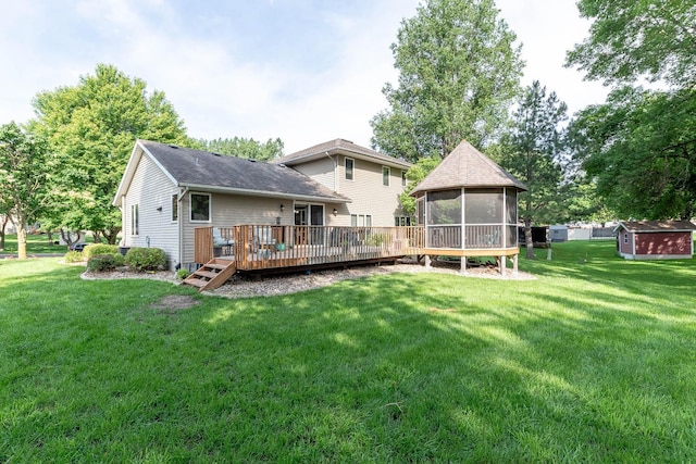 25 Piccadilly Pl, Mankato, MN 56001 - rear view of house with a sunroom, a storage unit, a wooden deck, and a lawn