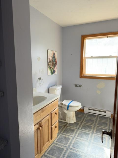 7300 County Road 8 NE, Longville, MN 56655 - bathroom with baseboard heating and vanity