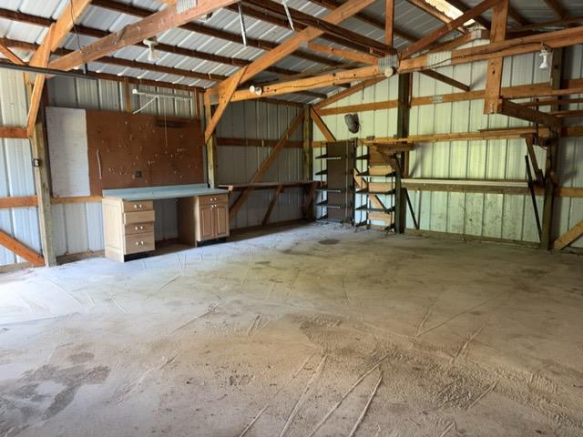 7300 County Road 8 NE, Longville, MN 56655 - garage featuring metal wall