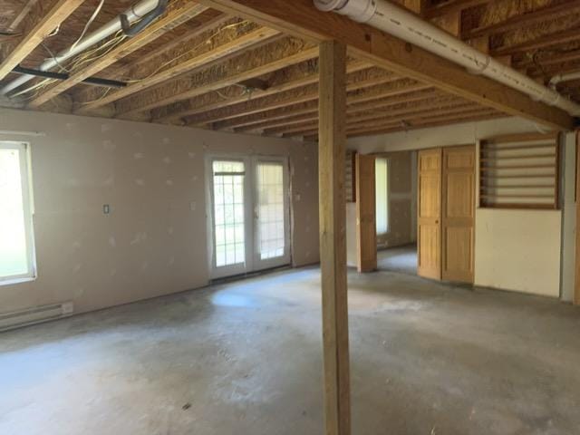 7300 County Road 8 NE, Longville, MN 56655 - misc room with unfinished concrete flooring and a baseboard radiator