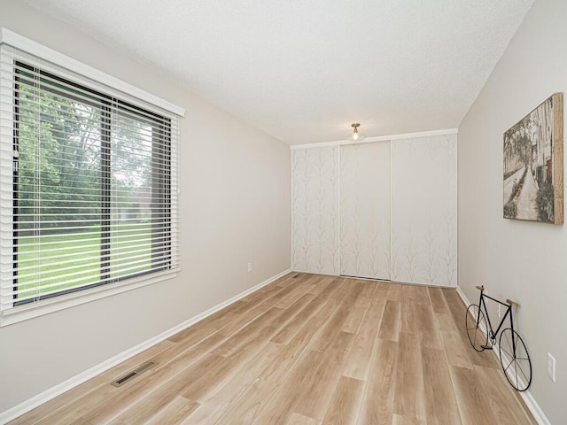 1181 Yuma Ln N, Plymouth, MN 55447 - unfurnished room with light wood-style flooring and baseboards