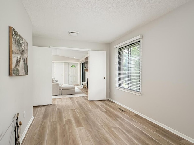 1181 Yuma Ln N, Plymouth, MN 55447 - corridor with light wood finished floors and a textured ceiling