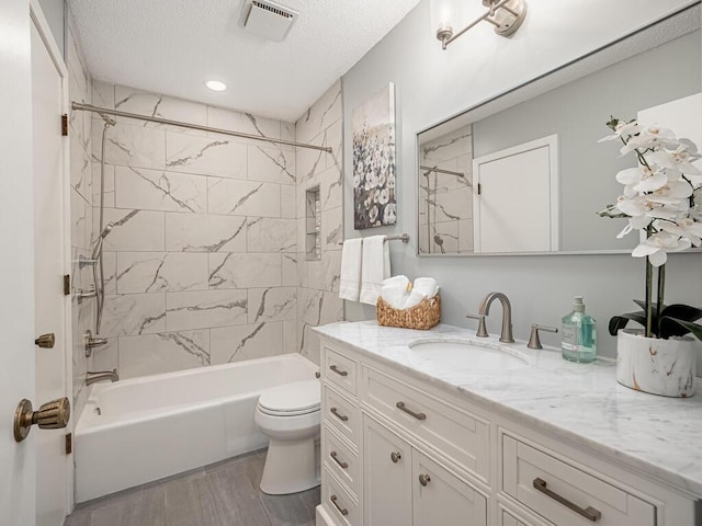 1181 Yuma Ln N, Plymouth, MN 55447 - bathroom featuring vanity, shower / washtub combination, wood finished floors, and a textured ceiling