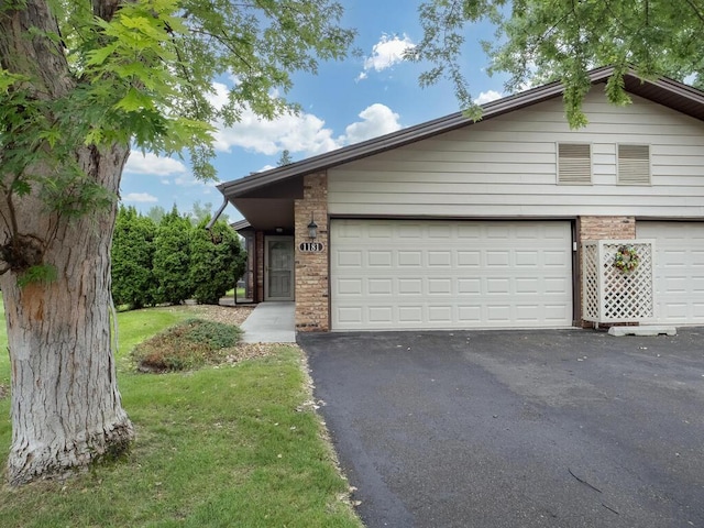 1181 Yuma Ln N, Plymouth, MN 55447 - view of front facade with brick siding and driveway