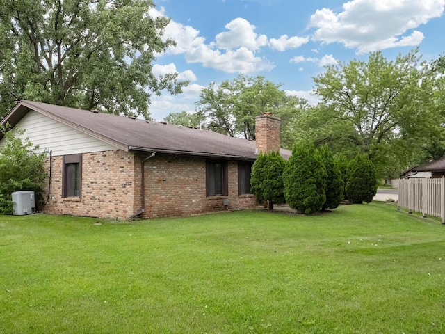 1181 Yuma Ln N, Plymouth, MN 55447 - view of property exterior with a chimney and brick siding