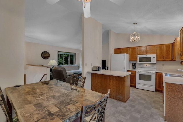 104 9th Ave N, Sartell, MN 56377 - kitchen featuring white appliances, vaulted ceiling, a peninsula, brown cabinetry, and light countertops
