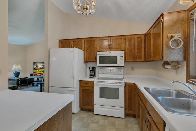 104 9th Ave N, Sartell, MN 56377 - kitchen with white appliances, vaulted ceiling, brown cabinets, light countertops, and a chandelier