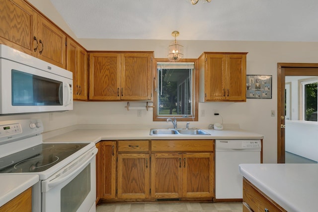 104 9th Ave N, Sartell, MN 56377 - kitchen featuring white appliances, light countertops, and brown cabinetry