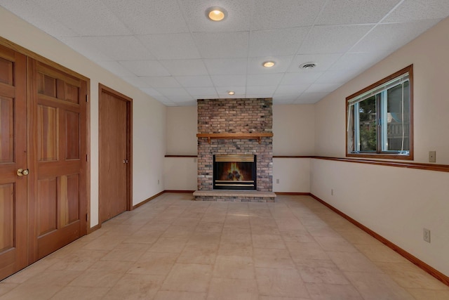 104 9th Ave N, Sartell, MN 56377 - unfurnished living room featuring a paneled ceiling and a fireplace