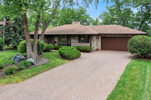 1267 Nursery Hill Ln, Arden Hills, MN 55112 - ranch-style home featuring a garage, a chimney, decorative driveway, a shingled roof, and a front lawn