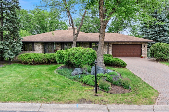 1267 Nursery Hill Ln, Arden Hills, MN 55112 - ranch-style home featuring a garage, decorative driveway, brick siding, and a front yard