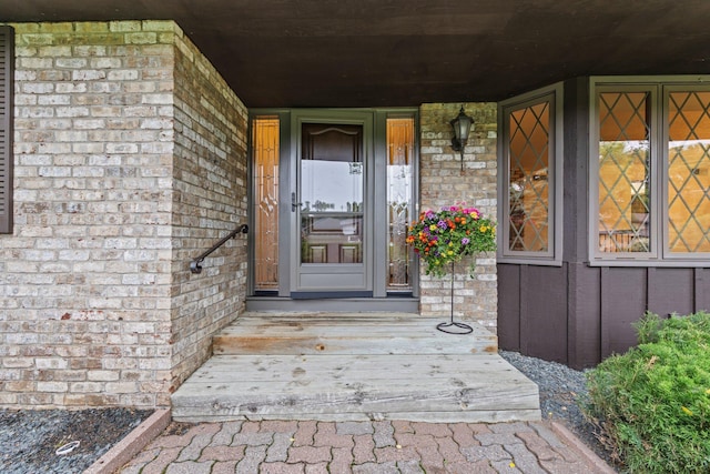 1267 Nursery Hill Ln, Arden Hills, MN 55112 - view of exterior entry featuring brick siding and covered porch