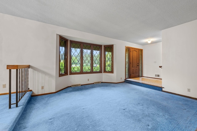 1267 Nursery Hill Ln, Arden Hills, MN 55112 - unfurnished room featuring carpet flooring and a textured ceiling