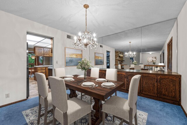 1267 Nursery Hill Ln, Arden Hills, MN 55112 - dining space featuring a chandelier, carpet flooring, and a textured ceiling