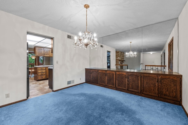 1267 Nursery Hill Ln, Arden Hills, MN 55112 - unfurnished dining area with a chandelier, light carpet, and a textured ceiling