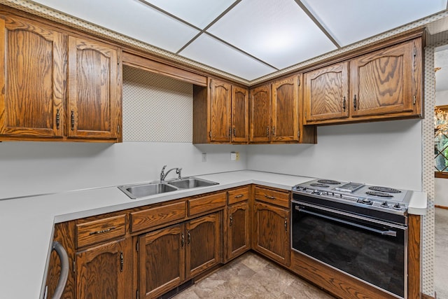 1267 Nursery Hill Ln, Arden Hills, MN 55112 - kitchen featuring range with electric cooktop, light countertops, and brown cabinetry