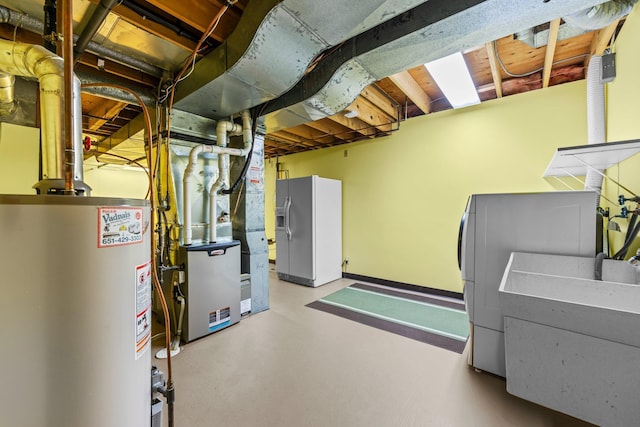 1267 Nursery Hill Ln, Arden Hills, MN 55112 - unfinished basement with gas water heater, white fridge with ice dispenser, and washer / dryer