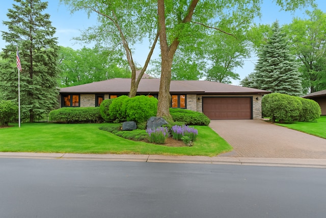 1267 Nursery Hill Ln, Arden Hills, MN 55112 - view of front of home with decorative driveway, an attached garage, and a front lawn