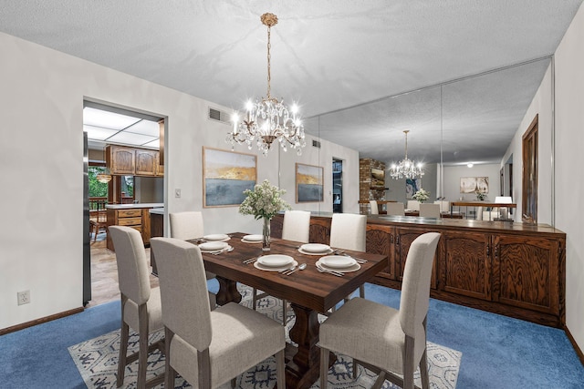 1267 Nursery Hill Ln, Arden Hills, MN 55112 - dining space with a chandelier, carpet flooring, and a textured ceiling