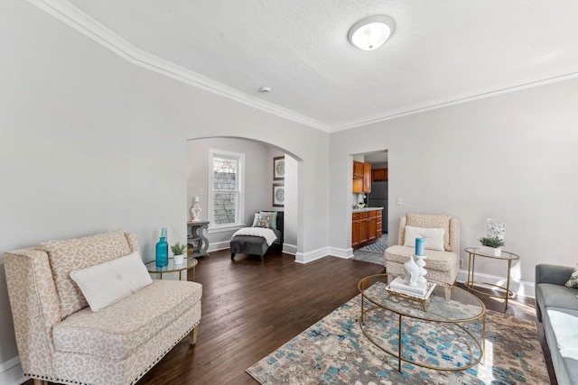 201 Genesee St, Saint Paul, MN 55117 - living area with arched walkways, crown molding, dark wood finished floors, and a textured ceiling