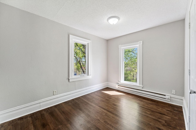 201 Genesee St, Saint Paul, MN 55117 - unfurnished room with a baseboard heating unit, dark wood finished floors, and a textured ceiling