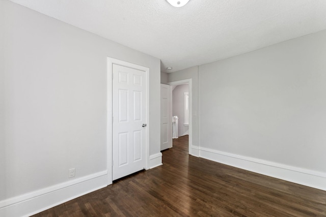 201 Genesee St, Saint Paul, MN 55117 - unfurnished room with dark wood finished floors and baseboards
