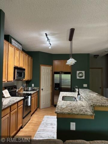 2460 119th Ct NE Unit D, Blaine, MN 55449 - kitchen with black microwave, electric range oven, stainless steel fridge with ice dispenser, track lighting, and light wood-type flooring