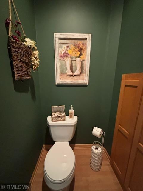 2460 119th Ct NE Unit D, Blaine, MN 55449 - bathroom featuring toilet and wood finished floors