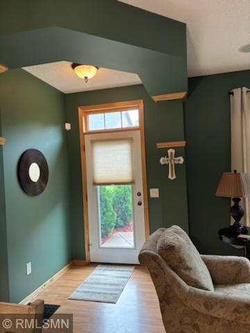 2460 119th Ct NE Unit D, Blaine, MN 55449 - entryway featuring wood finished floors and baseboards