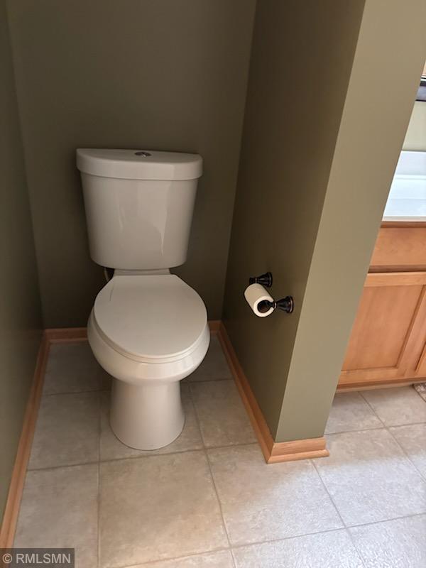 2460 119th Ct NE Unit D, Blaine, MN 55449 - bathroom with toilet and tile patterned floors