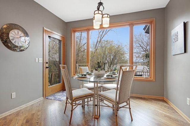 780 Virginia Shores Cir, Excelsior, MN 55331 - dining area featuring baseboards and wood finished floors