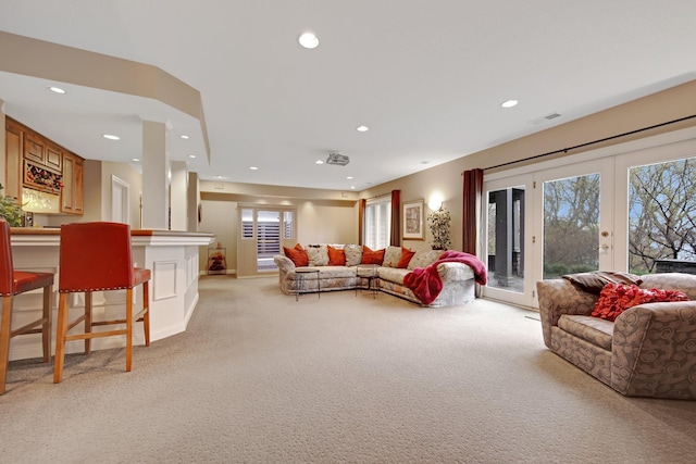 780 Virginia Shores Cir, Excelsior, MN 55331 - living room with light colored carpet, french doors, recessed lighting, and a bar