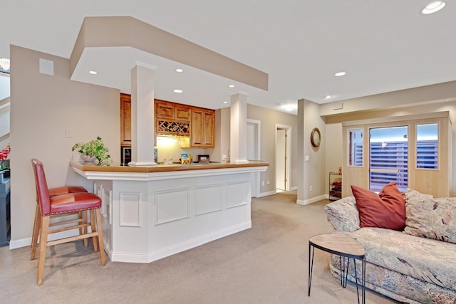 780 Virginia Shores Cir, Excelsior, MN 55331 - living room with bar with sink, light colored carpet, and recessed lighting