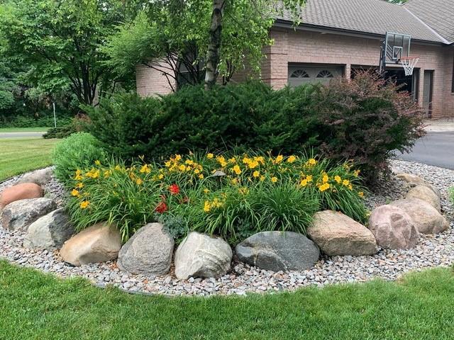 780 Virginia Shores Cir, Excelsior, MN 55331 - view of green lawn featuring an attached garage