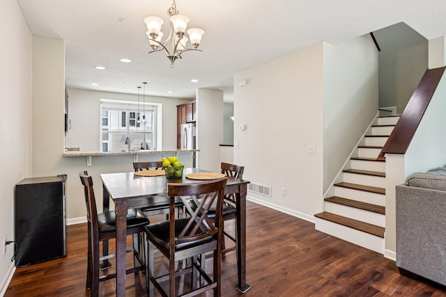8257 Norwood Ln N, Maple Grove, MN 55369 - dining space featuring a chandelier, stairway, dark wood-style flooring, and recessed lighting