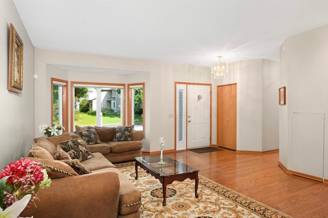 9035 Briarglen Rd, Eden Prairie, MN 55347 - living area with a chandelier and wood finished floors