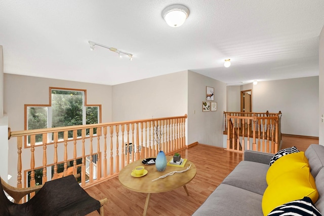 9035 Briarglen Rd, Eden Prairie, MN 55347 - living area featuring track lighting and wood finished floors
