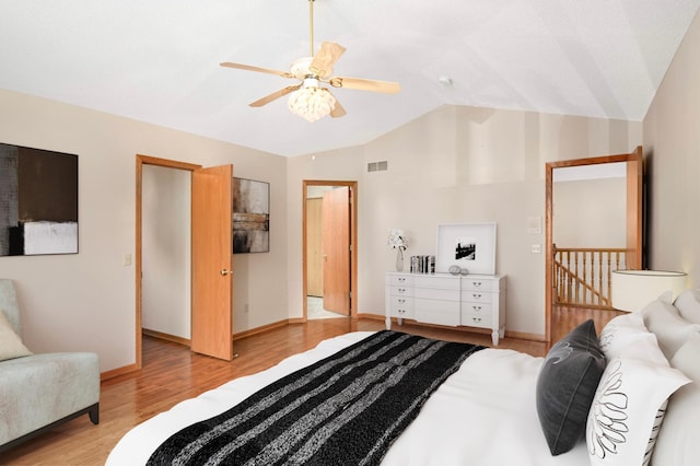 9035 Briarglen Rd, Eden Prairie, MN 55347 - bedroom with lofted ceiling, light wood-style flooring, and a ceiling fan