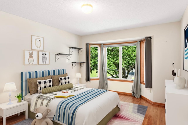 9035 Briarglen Rd, Eden Prairie, MN 55347 - bedroom with light wood finished floors and baseboards