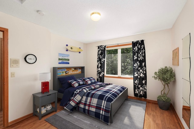 9035 Briarglen Rd, Eden Prairie, MN 55347 - bedroom with wood finished floors and baseboards