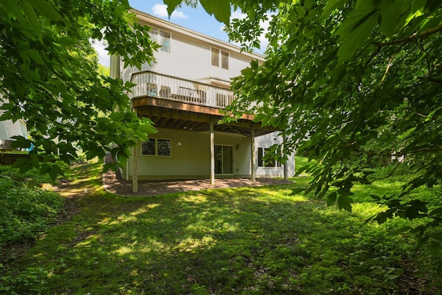 9035 Briarglen Rd, Eden Prairie, MN 55347 - back of house featuring a wooden deck, a lawn, and a patio