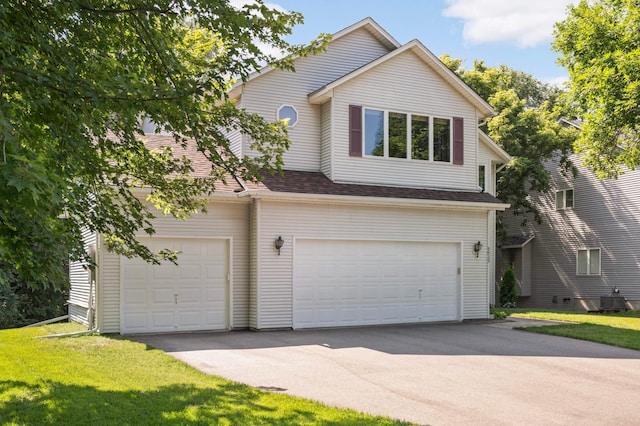 9035 Briarglen Rd, Eden Prairie, MN 55347 - view of front of property featuring an attached garage, driveway, a front lawn, and a shingled roof