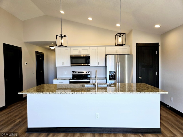 2101 Nelson St, Saint Peter, MN 56082 - kitchen featuring appliances with stainless steel finishes, an island with sink, white cabinetry, dark wood finished floors, and light stone counters