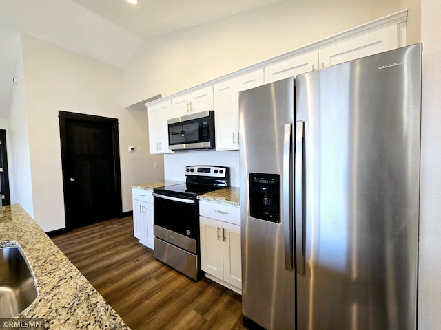 2101 Nelson St, Saint Peter, MN 56082 - kitchen featuring stainless steel appliances, dark wood-type flooring, light stone countertops, white cabinets, and lofted ceiling