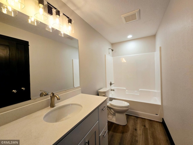 2101 Nelson St, Saint Peter, MN 56082 - bathroom featuring wood finished floors, vanity, and shower / washtub combination