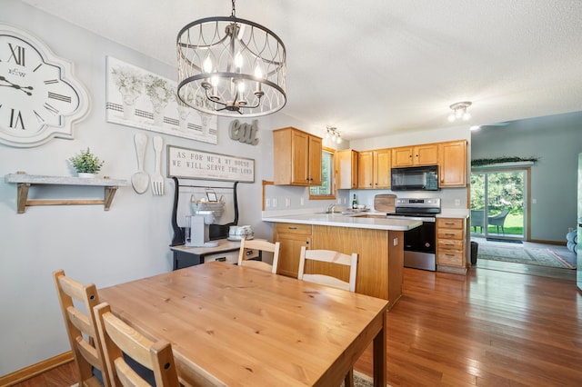 728 Elm St, Belle Plaine, MN 56011 - dining area featuring a chandelier, wood finished floors, and a textured ceiling