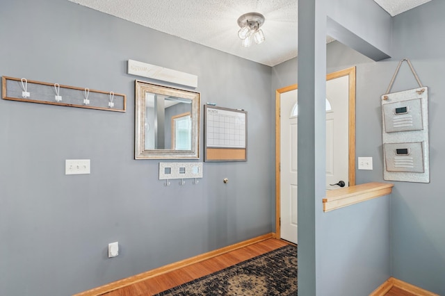 728 Elm St, Belle Plaine, MN 56011 - bathroom with wood finished floors and a textured ceiling