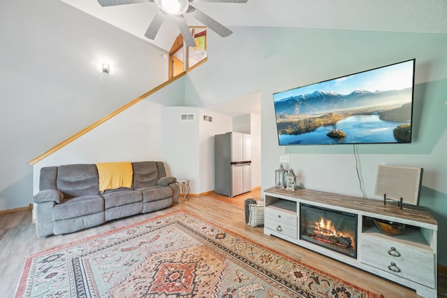 728 Elm St, Belle Plaine, MN 56011 - living area featuring lofted ceiling, wood finished floors, and ceiling fan
