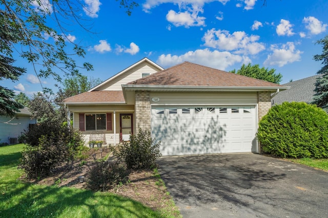 728 Elm St, Belle Plaine, MN 56011 - ranch-style house with asphalt driveway, an attached garage, brick siding, and roof with shingles