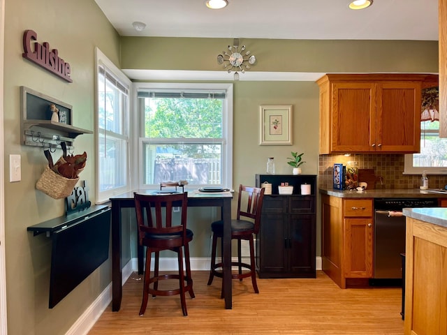 8412 4th Ave S, Bloomington, MN 55420 - kitchen with dishwasher, brown cabinetry, light wood-style floors, and recessed lighting